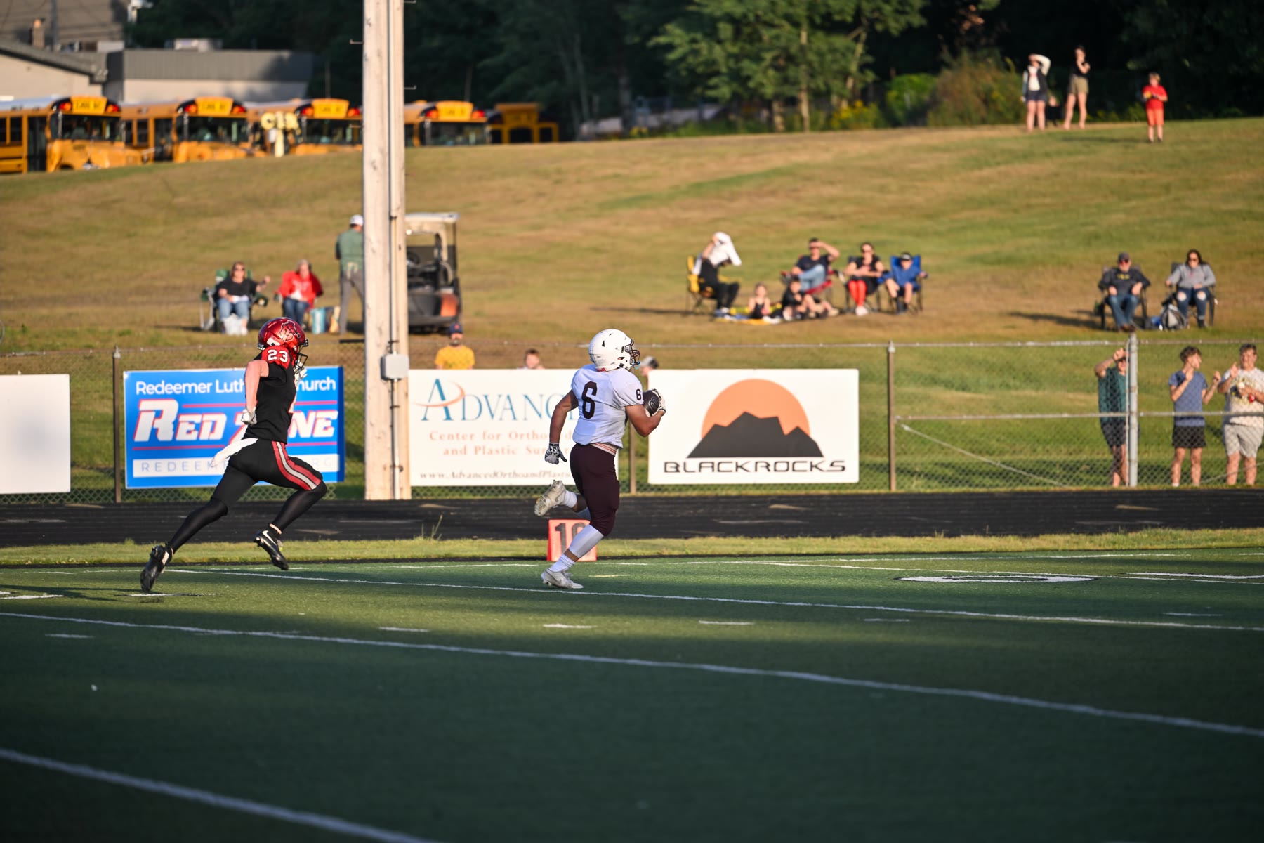 Menominee’s Jackson Myszak gets to the outside with Marquette’s Jack Keough in pursuit in the first half. Myszak carried 25 times for 240 yards.