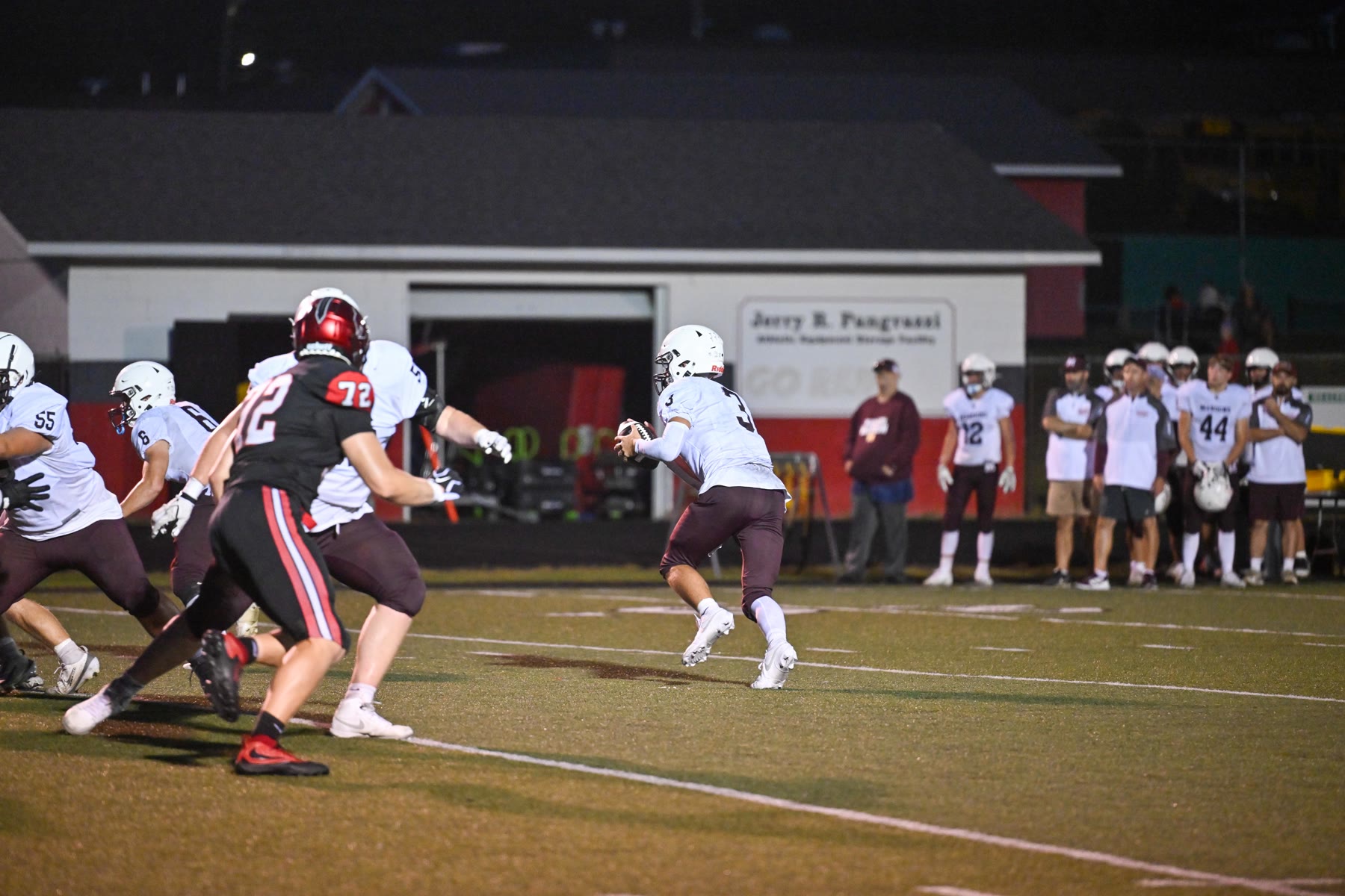 Dylan Beal looks downfield in the second half. The Menominee quarterback completed nine of his 11 attempts for 209 yards and five touchdowns.