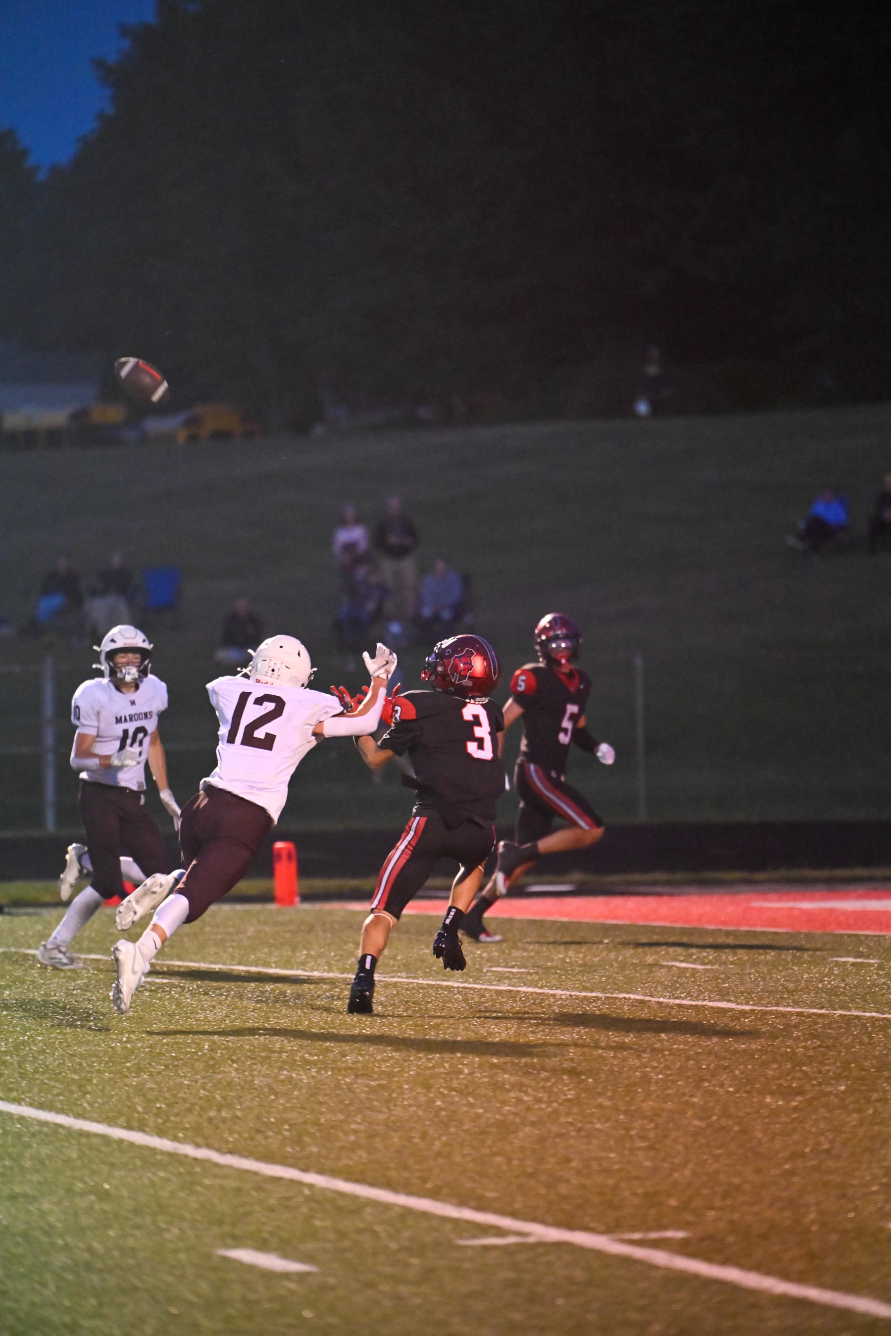 Thonne gets behind Marquette’s Evan Brown (3) and Brody Clements (5) in the fourth quarter.