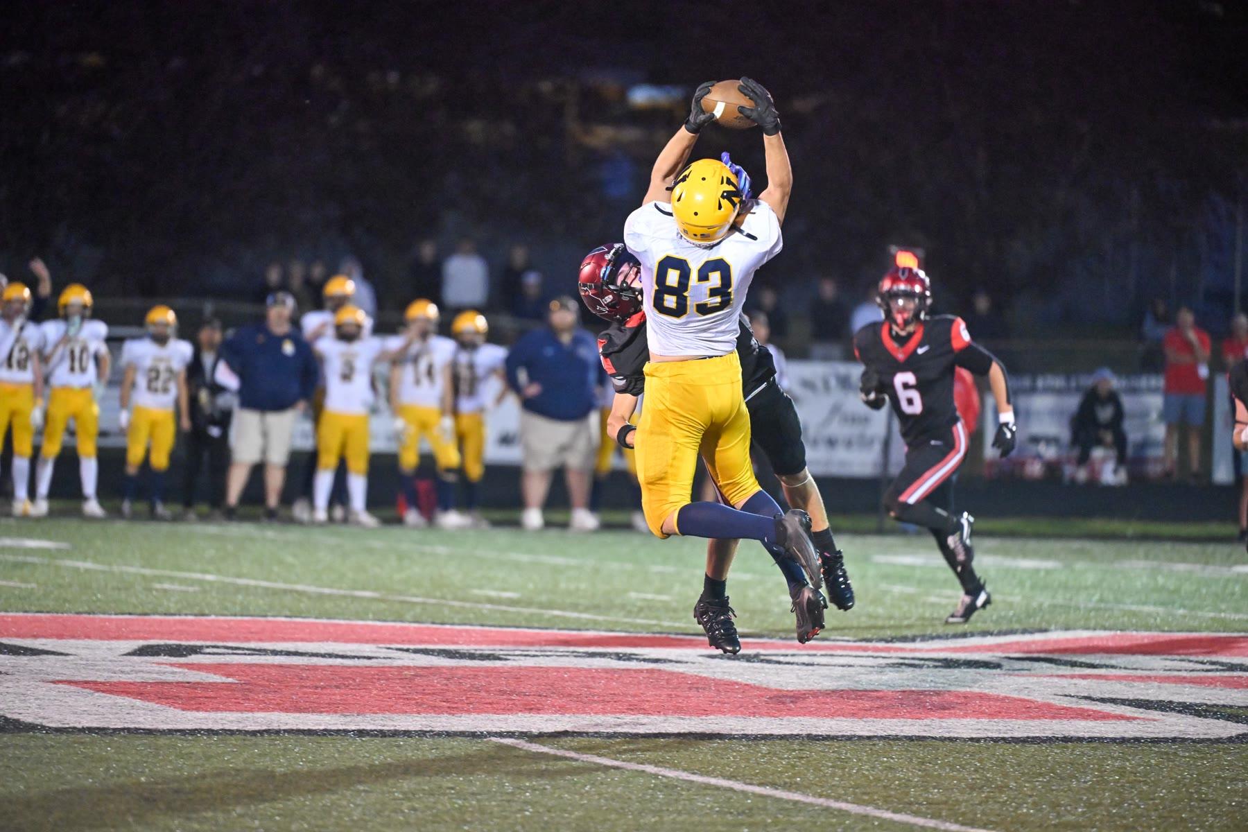 Negaunee’s Aries Korsman comes down with a pass over the middle in the third quarter.