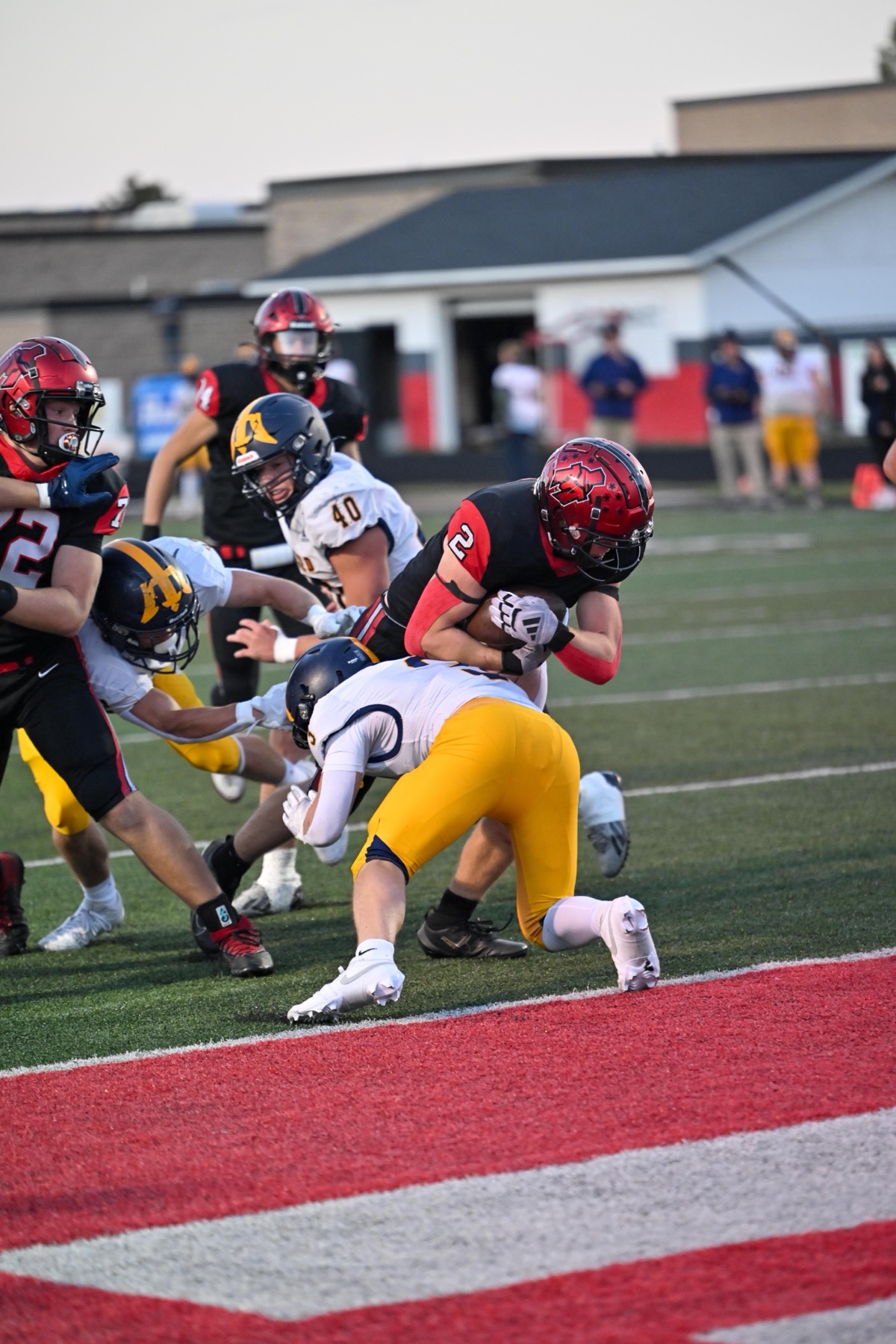 Landen Faccio (2) is wrapped up at the goal line in the first quarter. Faccio ran 22 times for 131 yards and a touchdown.