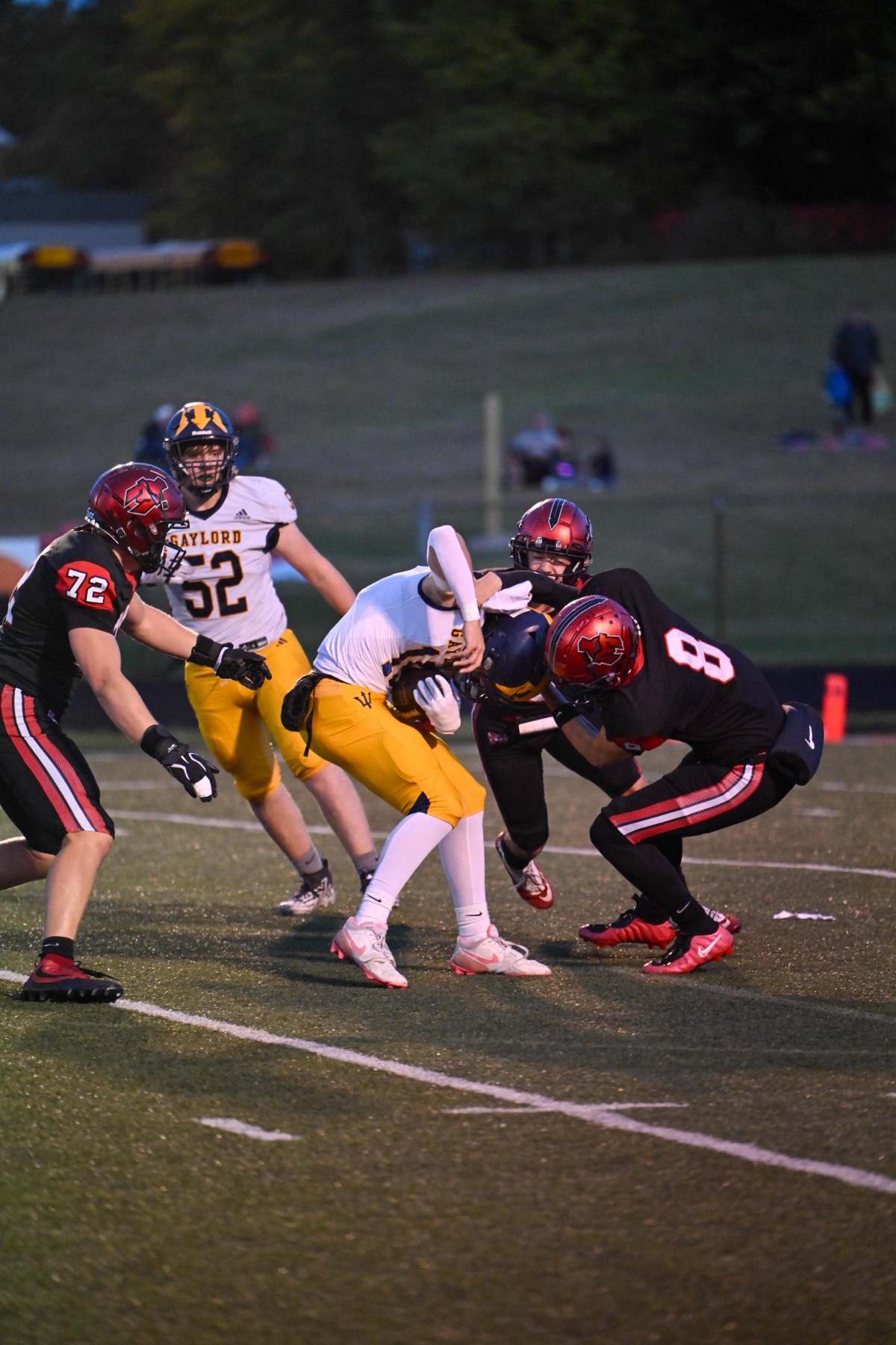 Connor D’Ambrosio (8) and the Marquette defense stop a Gaylord ball carrier in the first half.