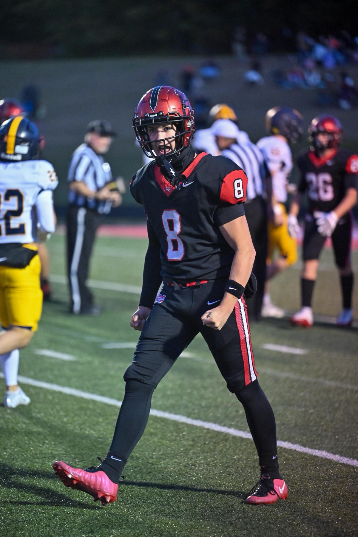 Connor D’Ambrosio (8) reacts after a Marquette stop, with Dylan Pond (26) in the background.