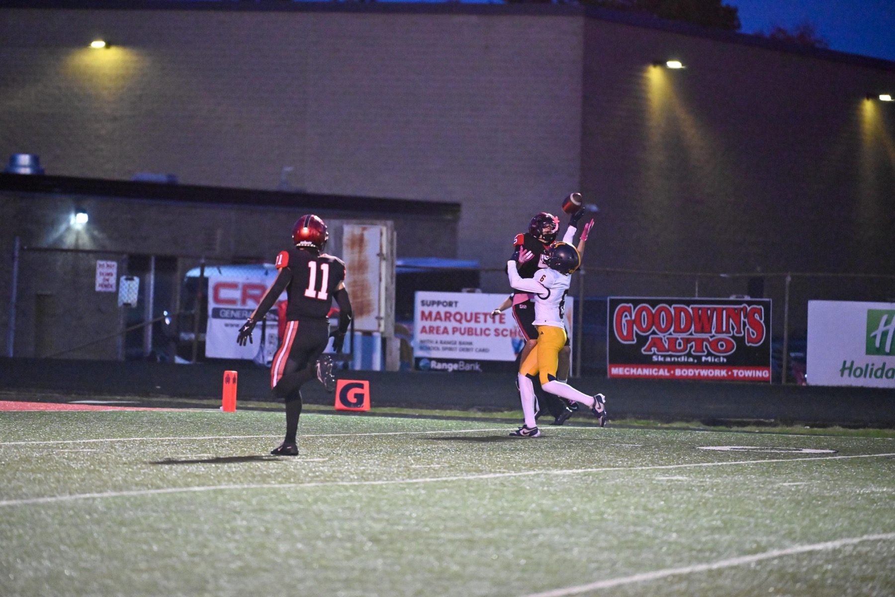 A pass drops in near the end zone with a Gaylord defender in coverage and Skyler Blackburn (11) trailing the play.